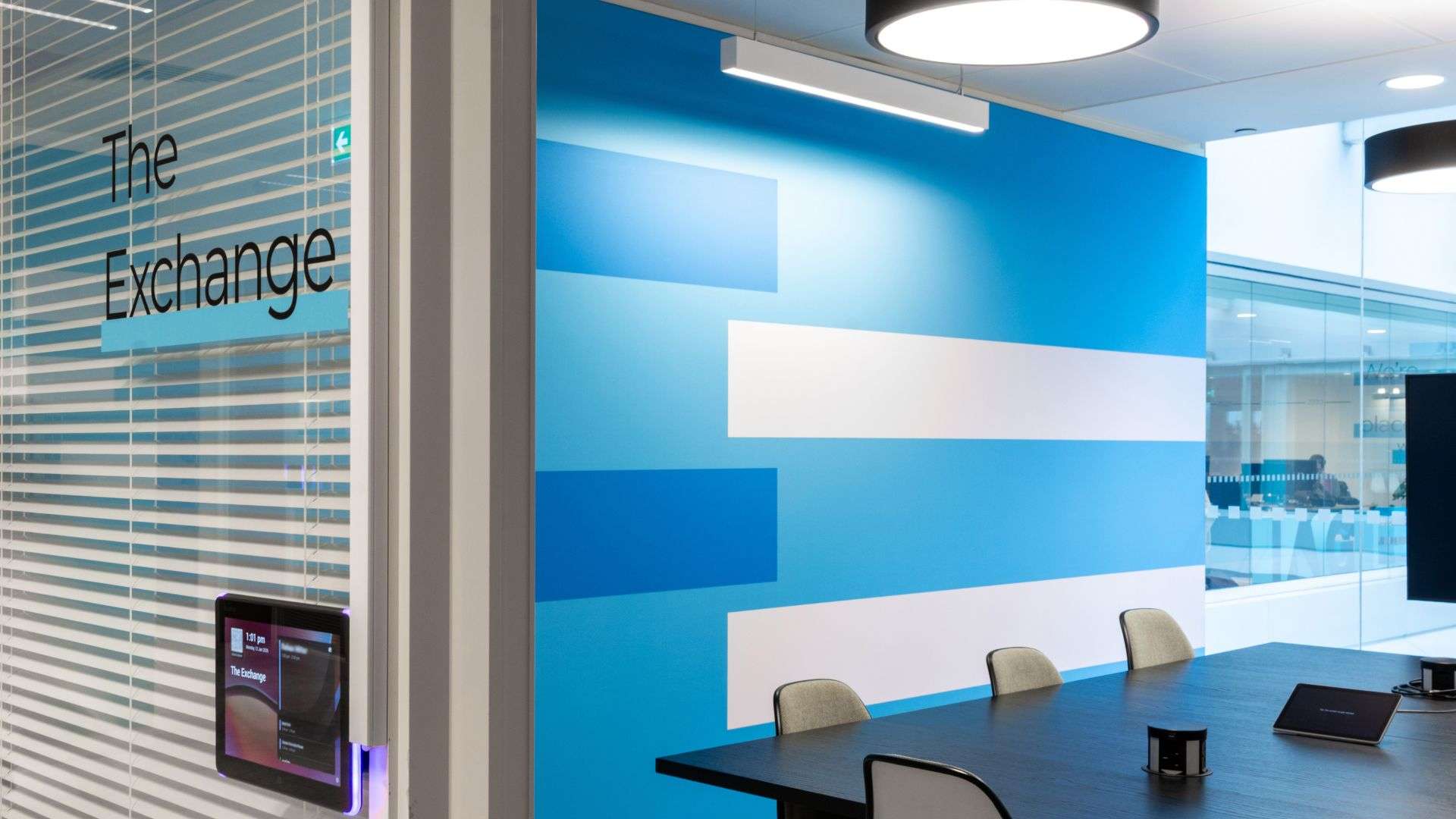 Blue wall with the words "The Exchange" in the foreground