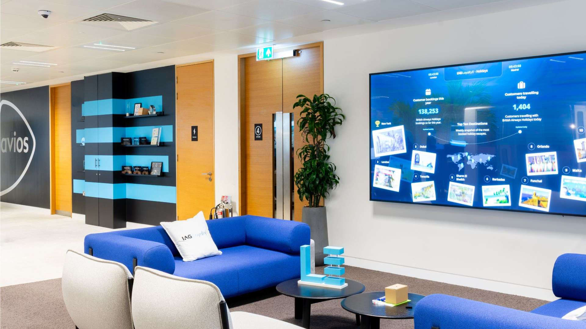 Casual seating area with screen behind