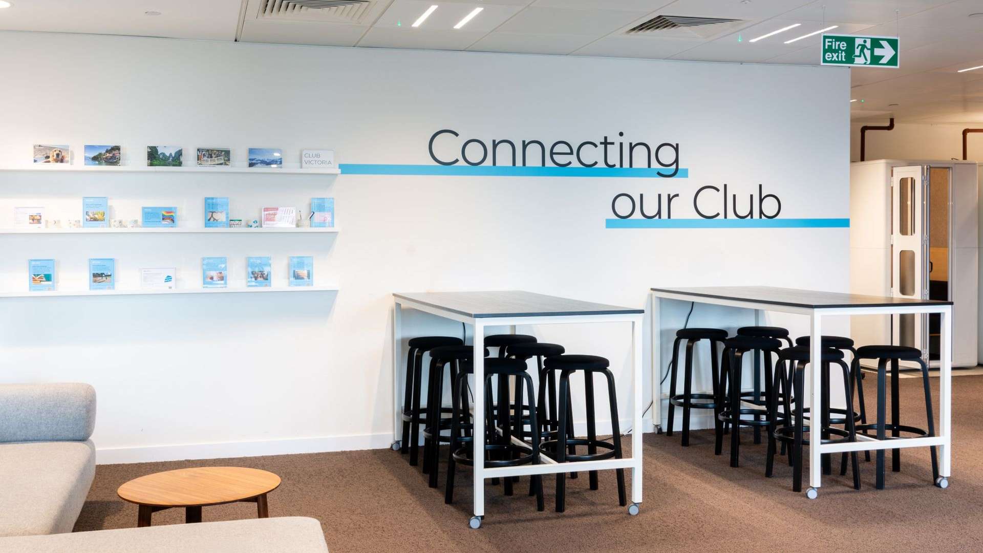 White wall with the words 'Connecting our Club'