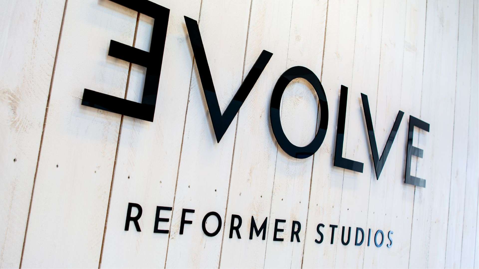 photo of evolve logo on a wall